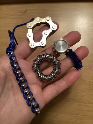 Customer photo review of "The Works" Fidget Kit - try ALL seven best sellers in one tin! Save $25!