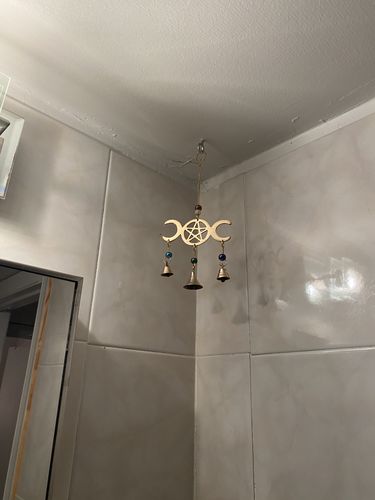 Customer photo review of Triple Moon Goddess Wind Chime with Brass Bells