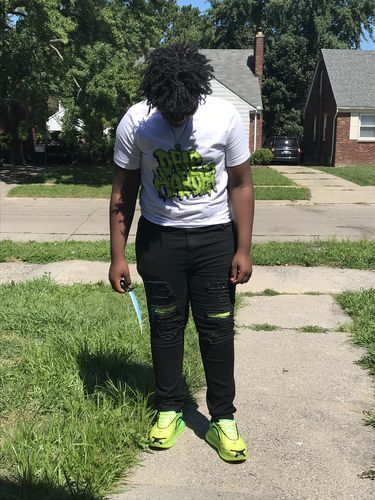 Customer photo review of Air Jordan 4 Neon "Drip Harder" Tee