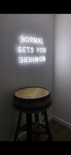 Customer photo review of 'Normal Gets You Nowhere' Neon Sign