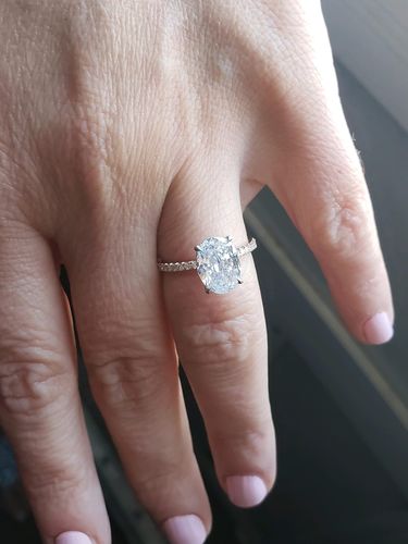 Customer photo review of 2.60 Carats Oval Cut Micropave Side Stones Hidden Halo Two-Tone Diamond Engagement Ring