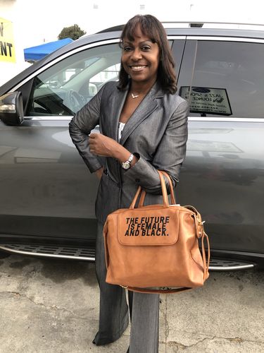 Customer photo review of THE FUTURE IS FEMALE AND BLACK. Convertible Handbag (more colors)