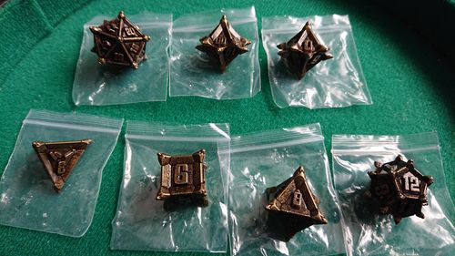 Customer photo review of Forgotten Warrior Dice Metal Dnd Dice Set