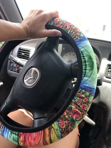 Customer photo review of Happy Rainbow Steering Wheel Cover