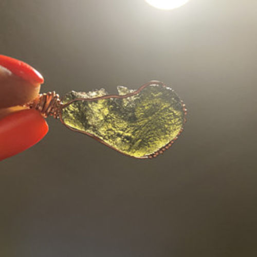 Customer photo review of Moldavite Pendant Necklace for Spiritual Awakening & Transformation.