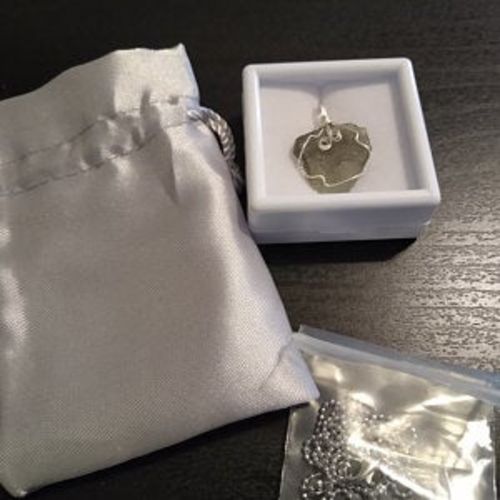 Customer photo review of Moldavite Pendant Necklace for Spiritual Awakening & Transformation.
