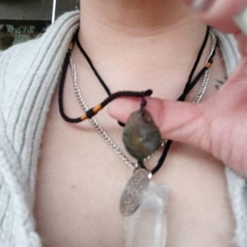 Customer photo review of Moldavite Pendant Necklace for Spiritual Awakening & Transformation.