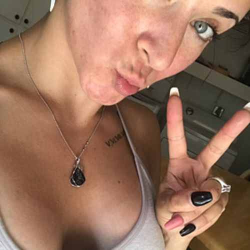 Customer photo review of Moldavite Pendant Necklace for Spiritual Awakening & Transformation.