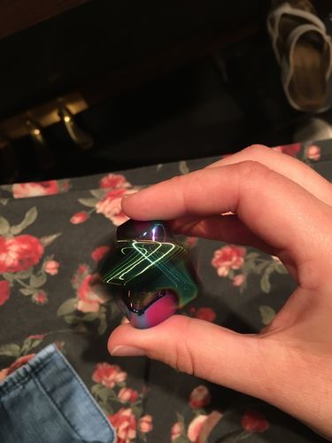 Customer photo review of Oil Slick Metal spinning cube Fidget