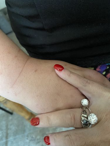 Customer photo review of Moissanite Fashion Flower Side Stone Sterling Silver Wedding Ring