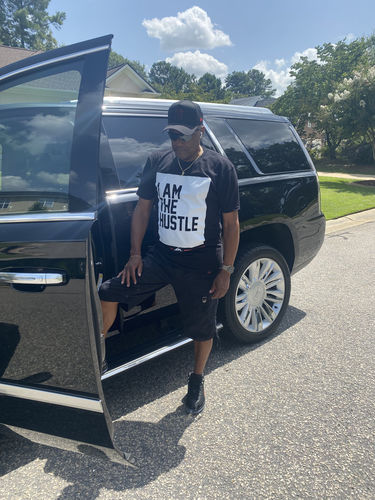 Customer photo review of I Am The Hustle Flag - Black Shirt