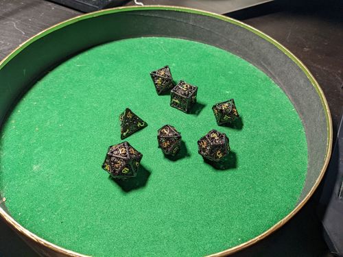 Customer photo review of Cthulhu the Deep One (Hollow) Metal Dnd Dice Set
