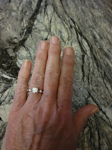 Customer photo review of Round Moissanite Sleek Accents Engagement Ring