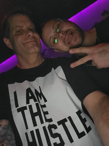 Customer photo review of I Am The Hustle Flag - Black Shirt