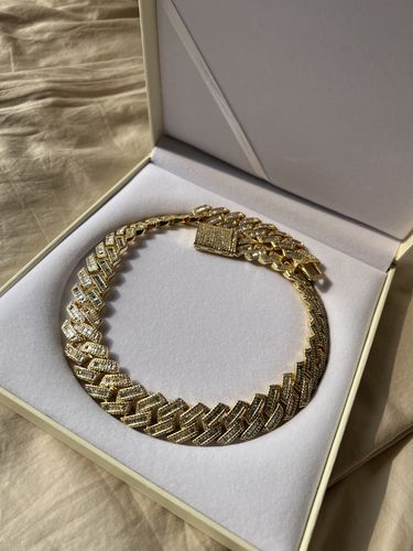 Customer photo review of The Proud Moment® - 20mm Baguette Cut Moissanite Diamond Prong Cuban Link Chain in 14K Gold