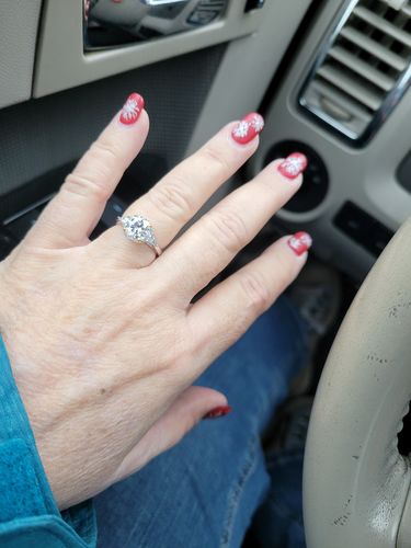 Customer photo review of Three Stone Moissanite Two Tone Halo Sterling Silver Ring