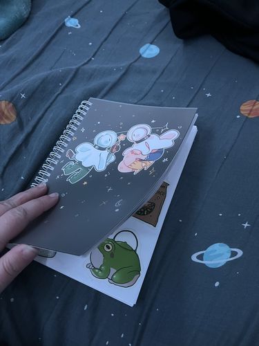 Customer photo review of Space Ghosts Duo Reusable Sticker Book