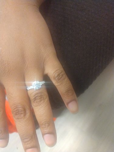 Customer photo review of Seven Stone Round Cut Moissanite Sterling Silver Ring