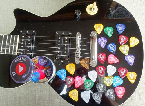 Customer photo review of Donner 48 Pack Celluloid Guitar Picks, Includes Thin, Medium, Heavy & Extra Heavy Gauges for Bass Electric Acoustic Guitars