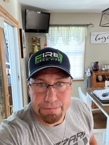 Customer photo review of Fire Cornhole Hat - Navy and Green/Silver Logo