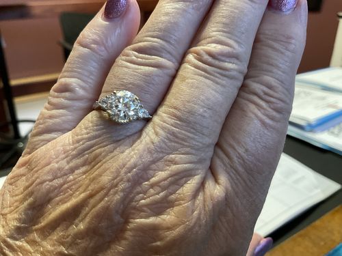 Customer photo review of Three Stone Moissanite Two Tone Halo Sterling Silver Ring