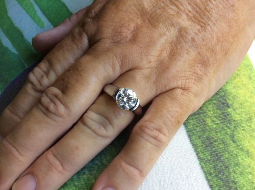 Customer photo review of Solitaire Moissanite Half Bezel Set Sterling Silver Engagement Ring