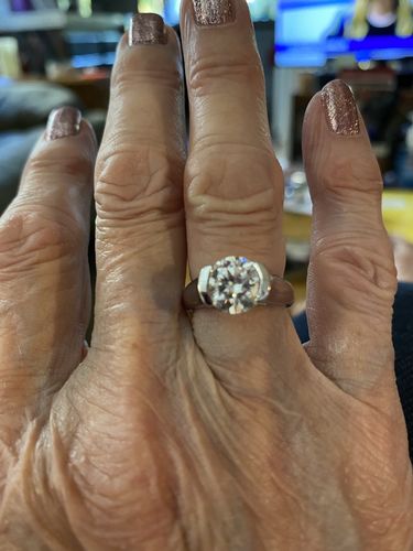 Customer photo review of Solitaire Moissanite Half Bezel Set Sterling Silver Engagement Ring