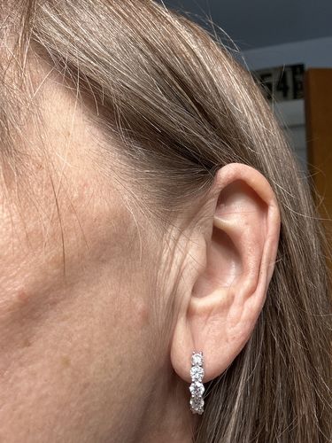 Customer photo review of Round Moissanite Huggie Hoop Sterling Silver Earrings