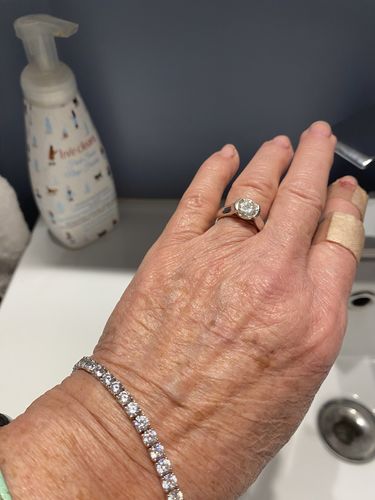 Customer photo review of Solitaire Moissanite Half Bezel Set Sterling Silver Engagement Ring