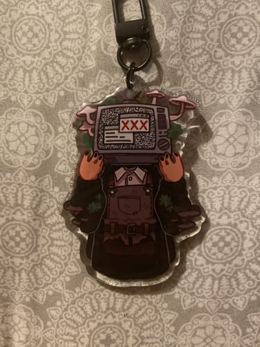 Customer photo review of TV Head Cute Acrylic Keychains