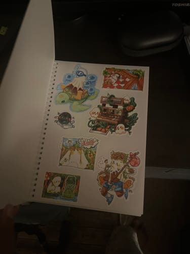 Customer photo review of Space Ghosts Duo Large Reusable Sticker Book