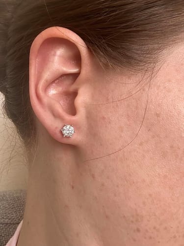 Customer photo review of Luxuria Moissanite 14K White Gold Plated Silver Stud Earrings