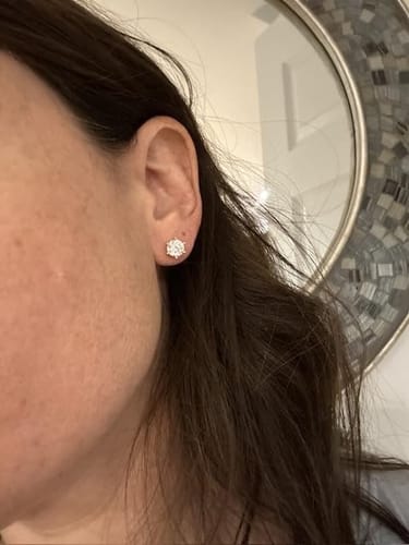 Customer photo review of Luxuria Moissanite 14K White Gold Plated Silver Stud Earrings