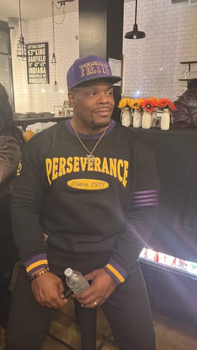 Customer photo review of Omega Psi Phi "PERSEVERANCE" Chenille Sweater Black