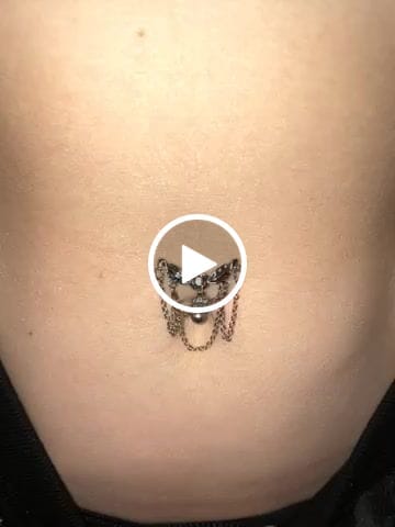 Customer video review of Reverse Chandelier Heart Dangle Belly Ring