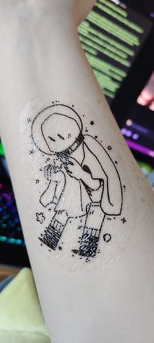 Customer photo review of Space Ghosts Temporary Tattoos