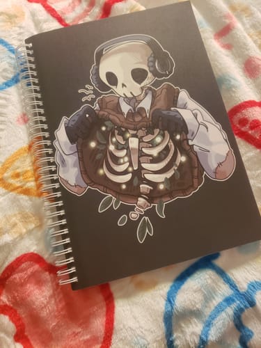 Customer photo review of Chilling Skeleton with Fireflies Large Reusable Sticker Book