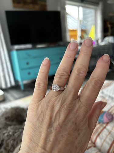 Customer photo review of Solitaire Moissanite Half Bezel Set Sterling Silver Engagement Ring