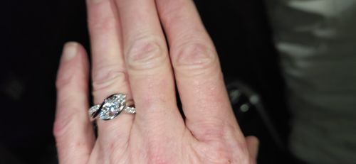 Customer photo review of Swirl Three Stone Moissanite Twisted Pave Engagement Ring