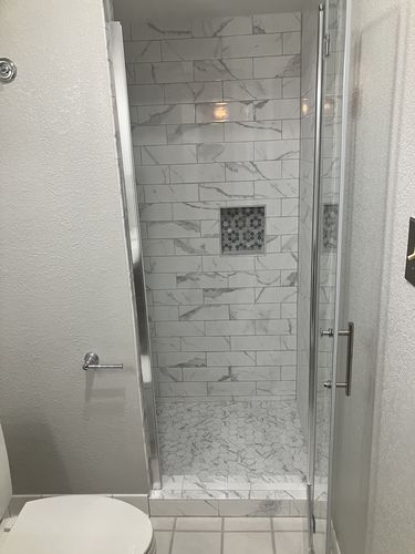 Customer photo review of SUNNY SHOWER 30 in. W x 72 in. H Frameless Chrome Finish Bi-Fold Shower Door