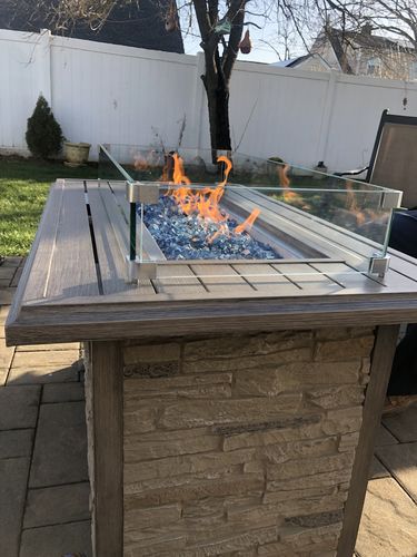 Customer photo review of 44'' Propane Gas Fire Pit Table 50000 BTU Auto-Ignition w/ Wind guard, Aluminum Tabletop,Waterproof Cover, Glass Beads, Brown Faux Stone Surface