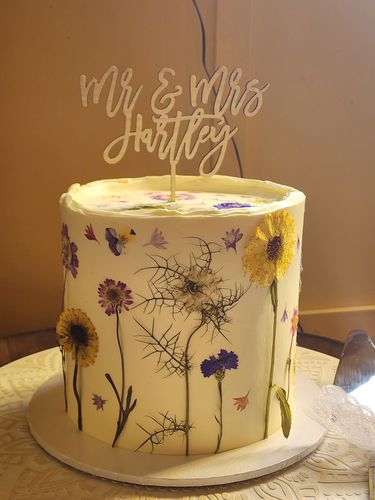 Customer photo review of Personalised Wedding Cake Topper (two colours available)
