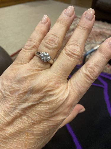 Customer photo review of Solitaire Moissanite Half Bezel Set Sterling Silver Engagement Ring