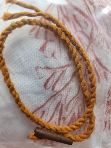 Customer photo review of Bracelet Saï sin (avec relique) et amulette Takut bénit par le Très Vénérable Luang Phor Koon.