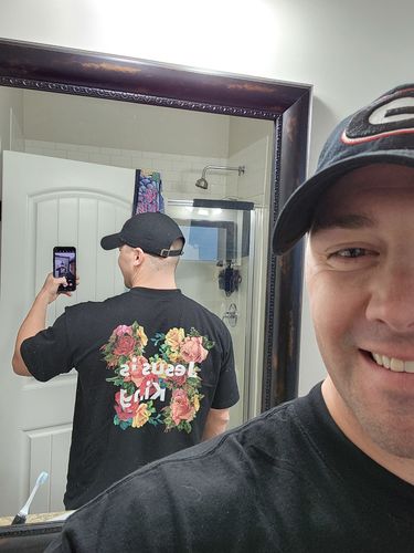 Customer photo review of Jesus is King Tee