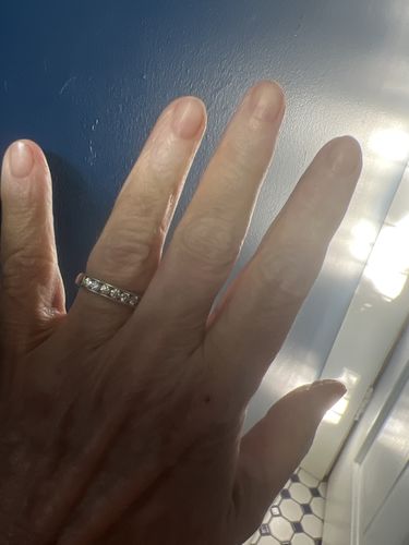 Customer photo review of Channel Set Moissanite Half Eternity Wedding Band Ring In Sterling Silver