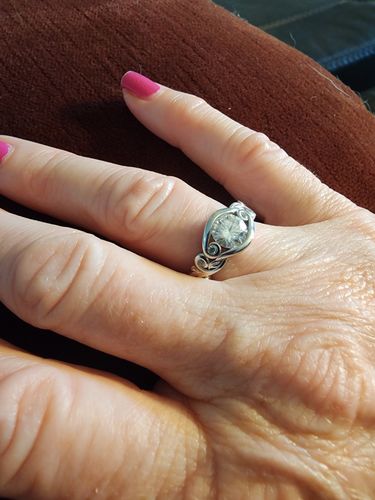 Customer photo review of Bezel Set Round Moissanite Scroll Accents Engagement Ring