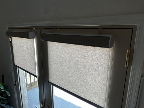 Customer photo review of SmartWings Motorized Light Filtering Roller Shades 70% Blackout Safari