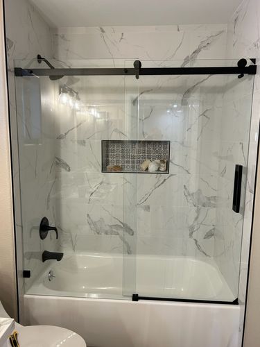 Customer photo review of SUNNY SHOWER 60" x 62" Bathtub Shower Door & Frameless Sliding Door for tub, Black Finish / Brushed Nickel Finish