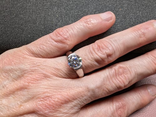 Customer photo review of Solitaire Moissanite Half Bezel Set Sterling Silver Engagement Ring